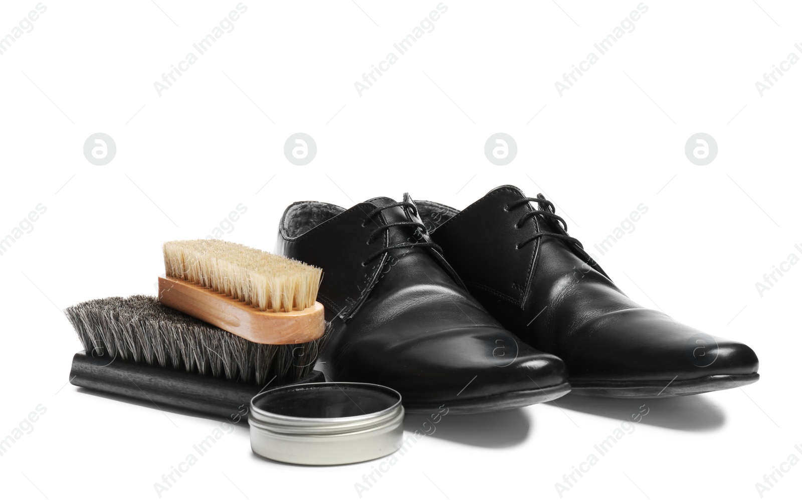 Photo of Stylish men's footwear and shoe care accessories on white background