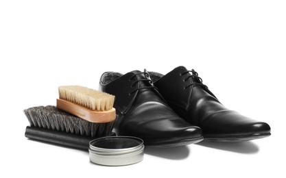 Photo of Stylish men's footwear and shoe care accessories on white background