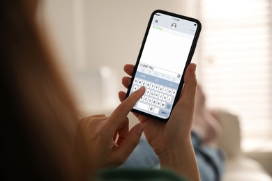 Woman sending message with text I Love You, closeup