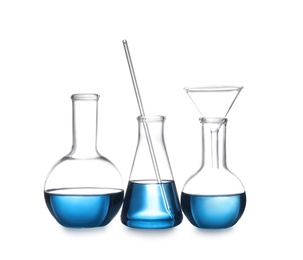 Photo of Set of laboratory glassware with blue liquid isolated on white