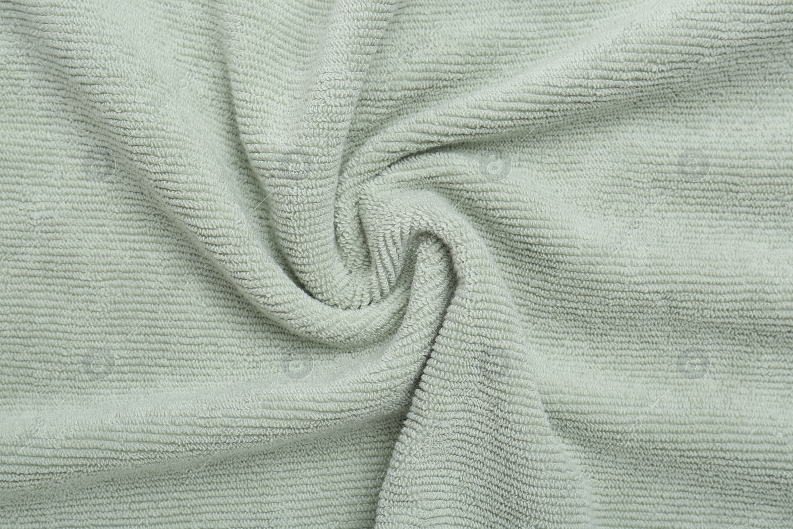 Photo of Crumpled soft towel as background, top view