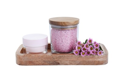 Glass container of pink sea salt, jar with cosmetic product and beautiful chrysanthemum flowers isolated on white