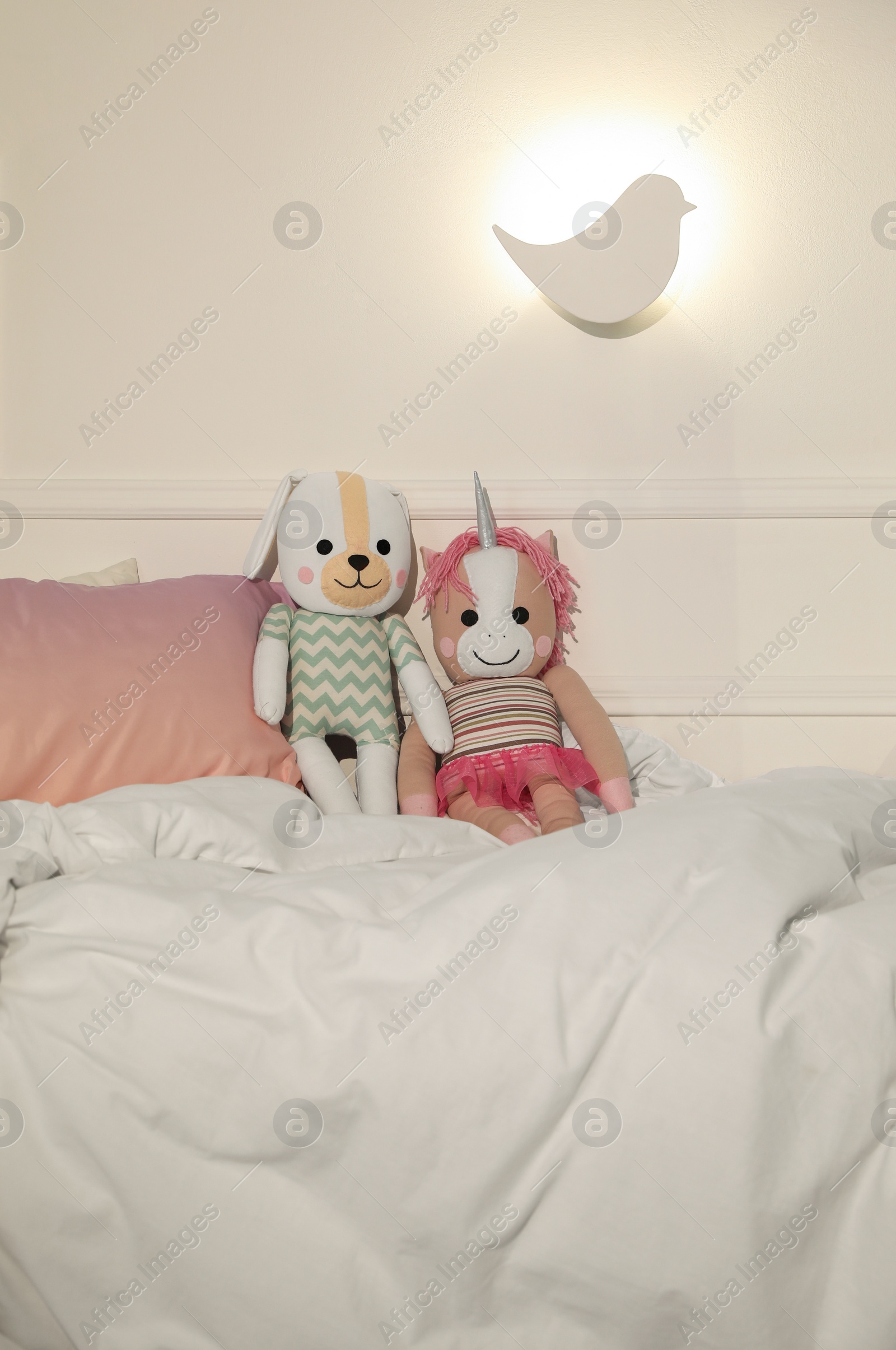 Photo of Bird shaped night lamp on wall in child's room