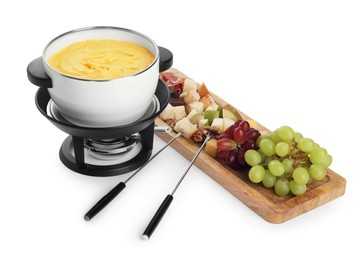 Fondue with tasty melted cheese, forks and different snacks isolated on white