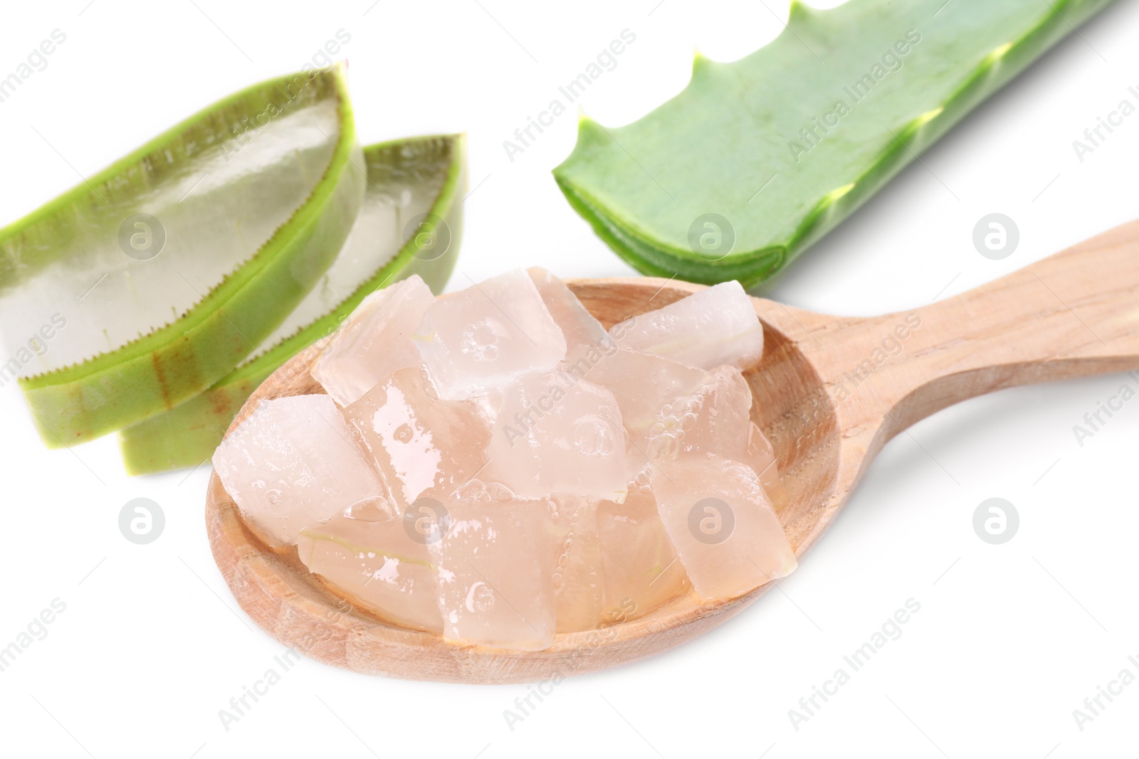 Photo of Aloe vera gel in spoon and slices of plant isolated on white, closeup