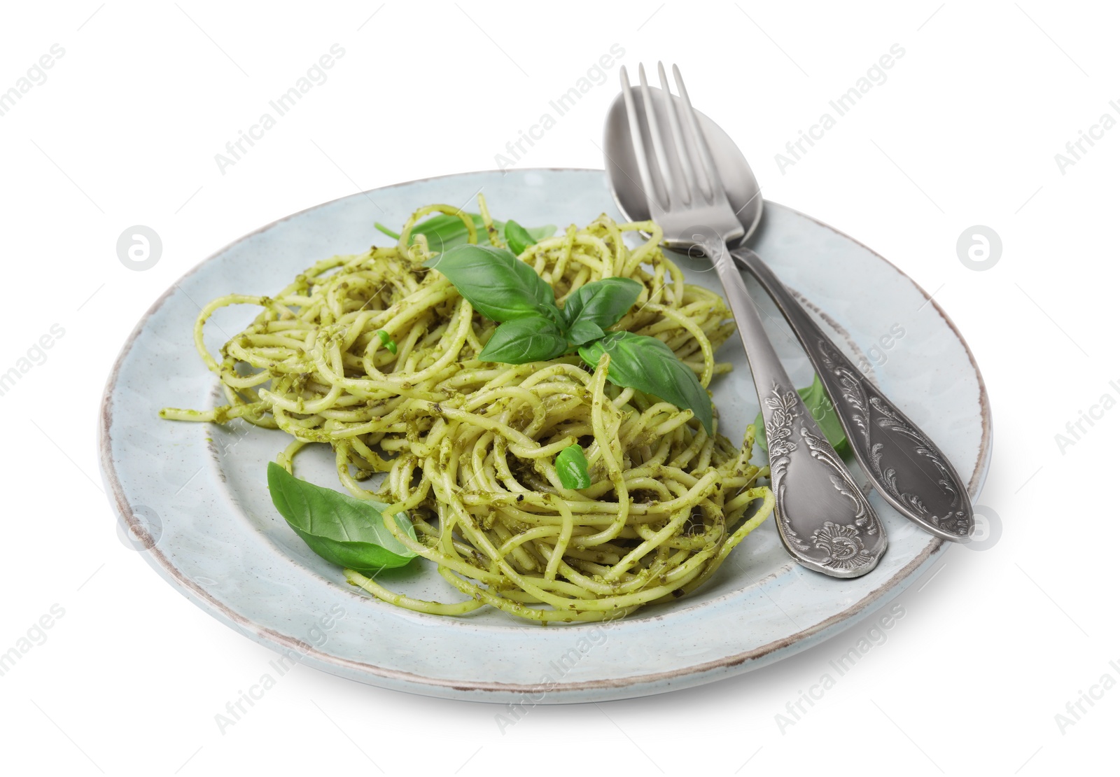 Photo of Delicious pasta with pesto sauce, basil and cutlery on white background