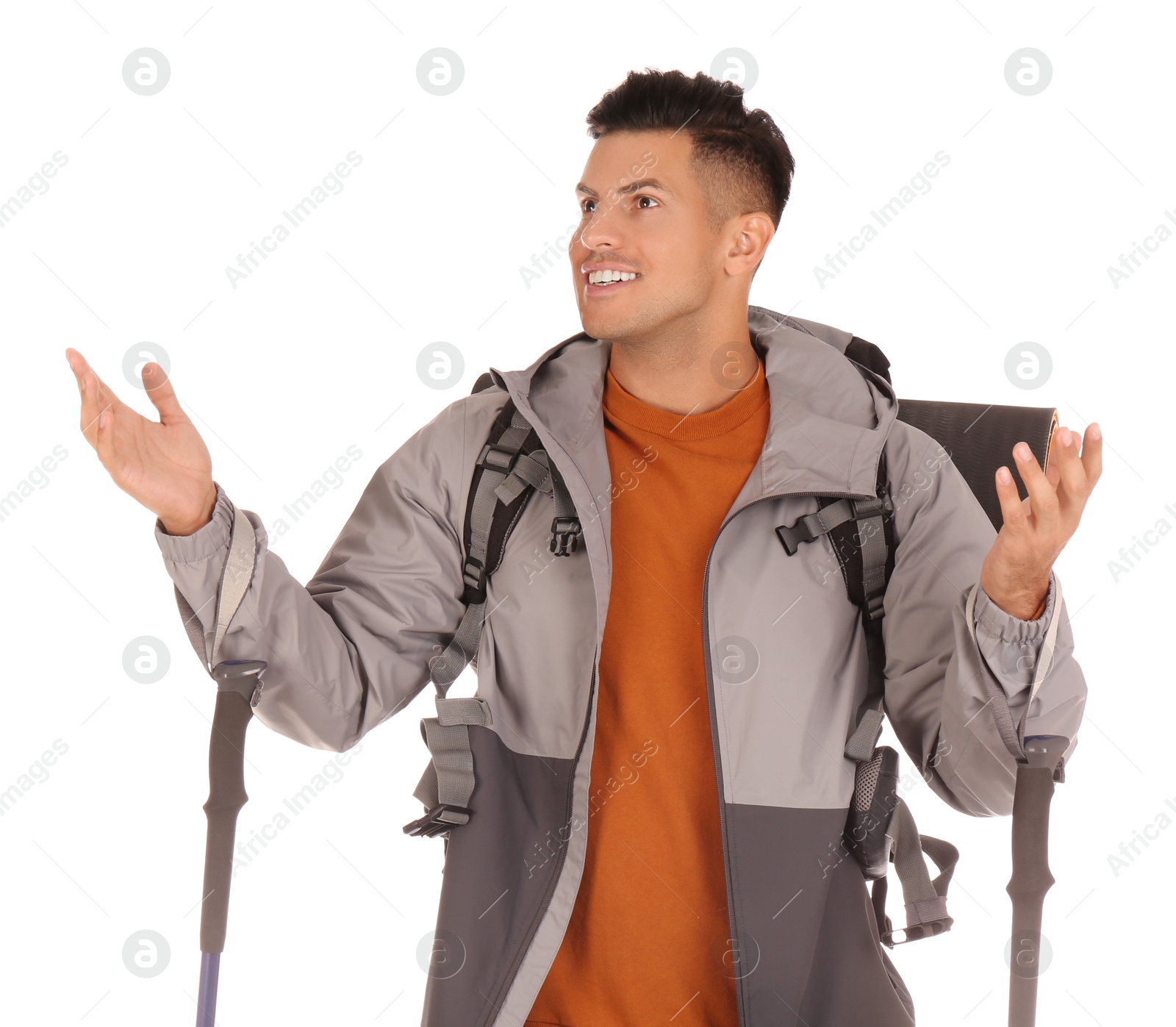 Photo of Male hiker with backpack and trekking poles on white background