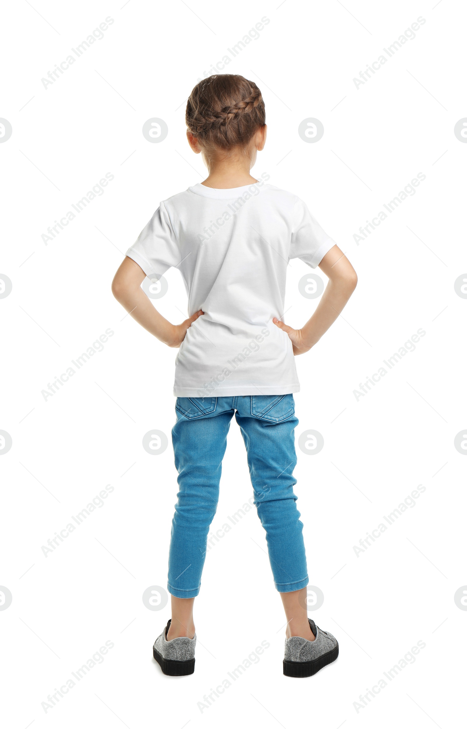 Photo of Little girl in t-shirt on white background. Mockup for design