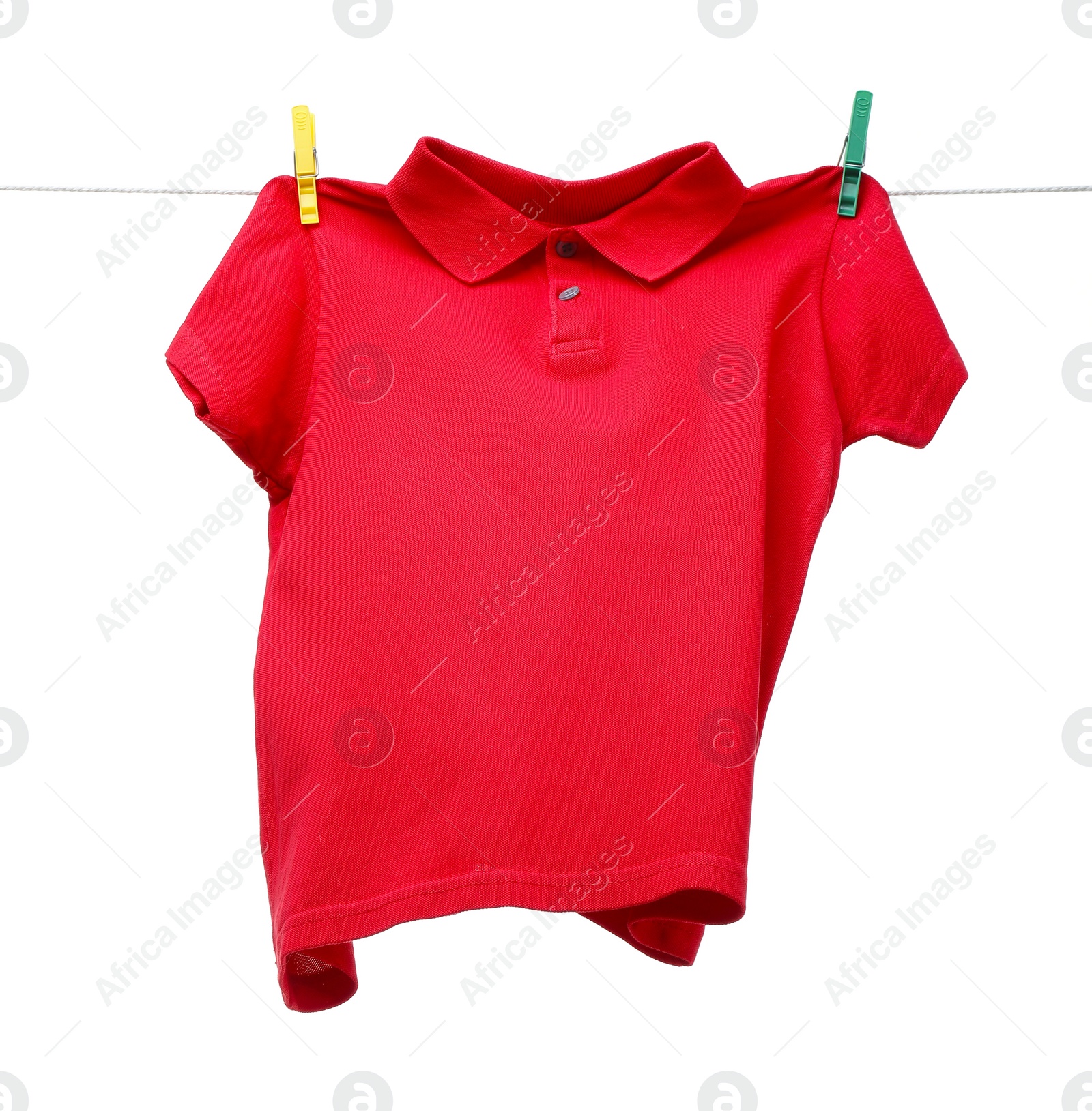 Photo of One red t-shirt drying on washing line isolated on white