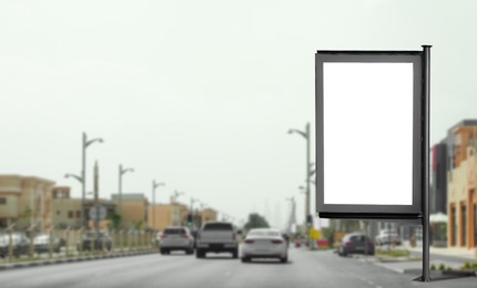 Image of Blank advertising board near road. Space for text
