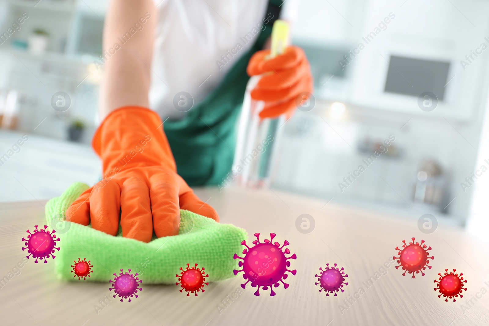 Image of Cleaning vs viruses. Woman washing table with sponge and disinfecting solution