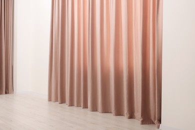 Photo of Elegant window curtains in room. Interior design