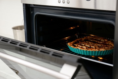 Delicious fresh homemade cake in modern oven