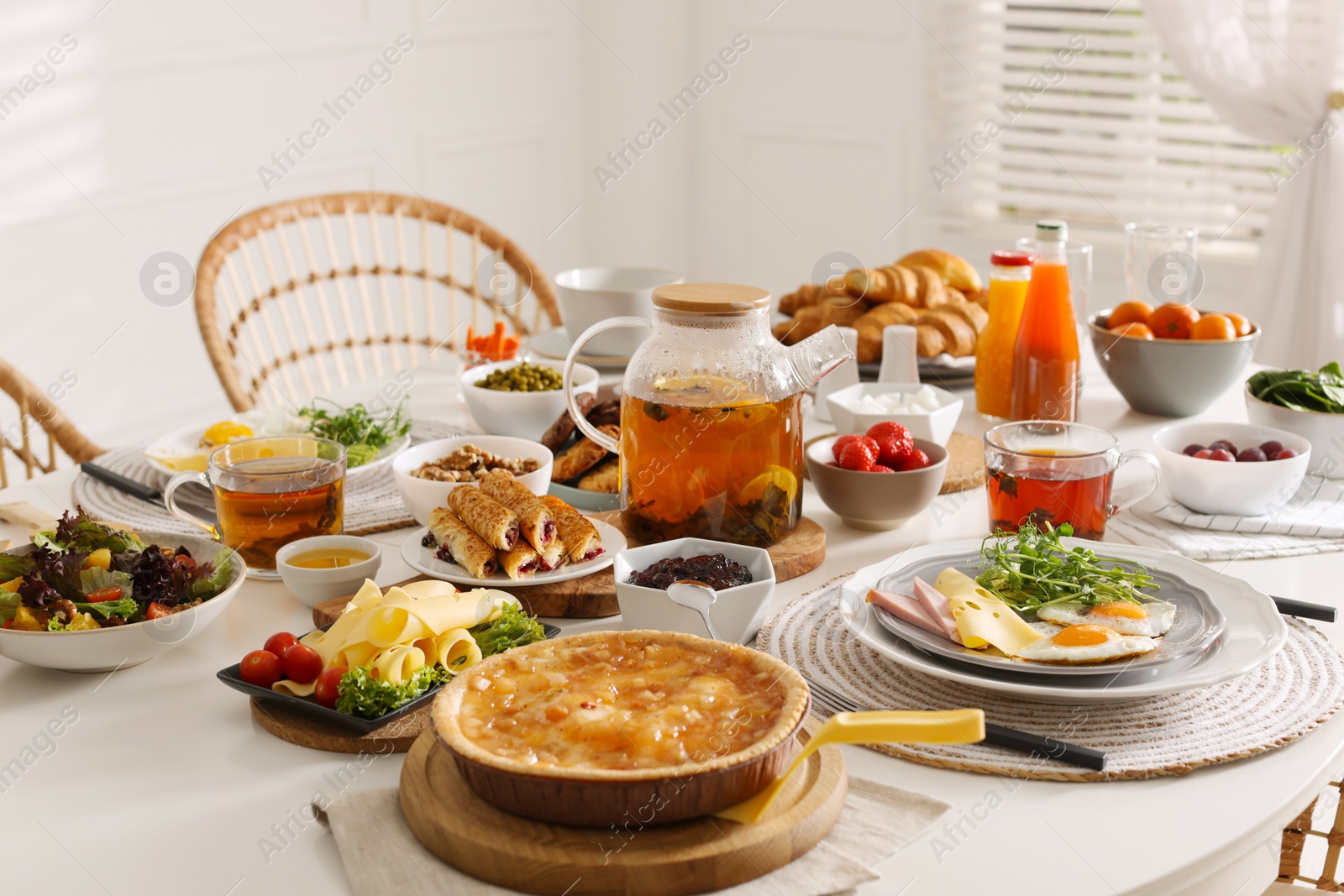 Photo of Many different dishes served on buffet table for brunch