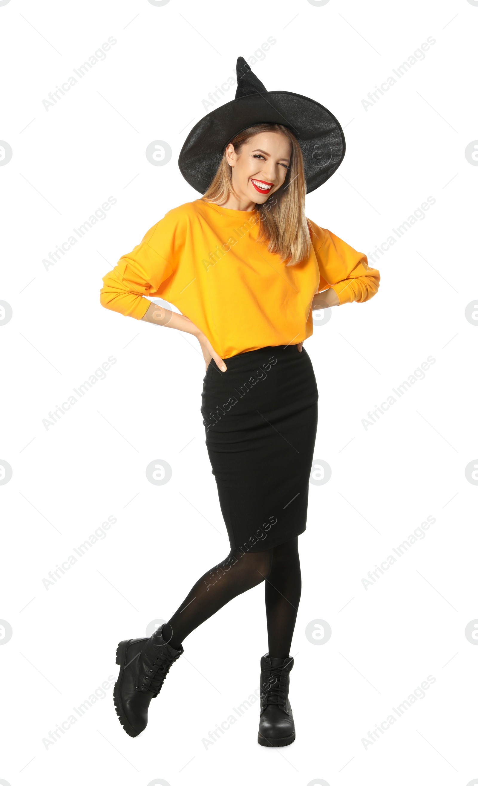 Photo of Beautiful young woman wearing witch costume for Halloween party on white background