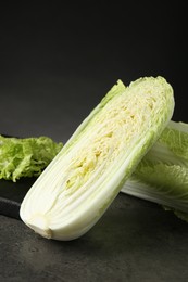 Fresh ripe Chinese cabbages on grey table