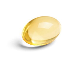Photo of Cod liver oil pill on white background