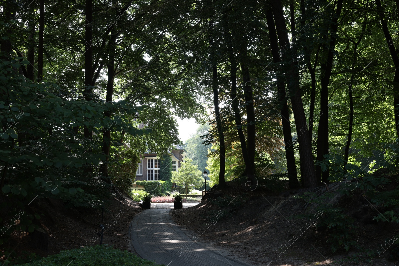 Photo of Ermelo, Netherlands - July 20, 2022: Pathway going to luxury hotel Het Roode Koper