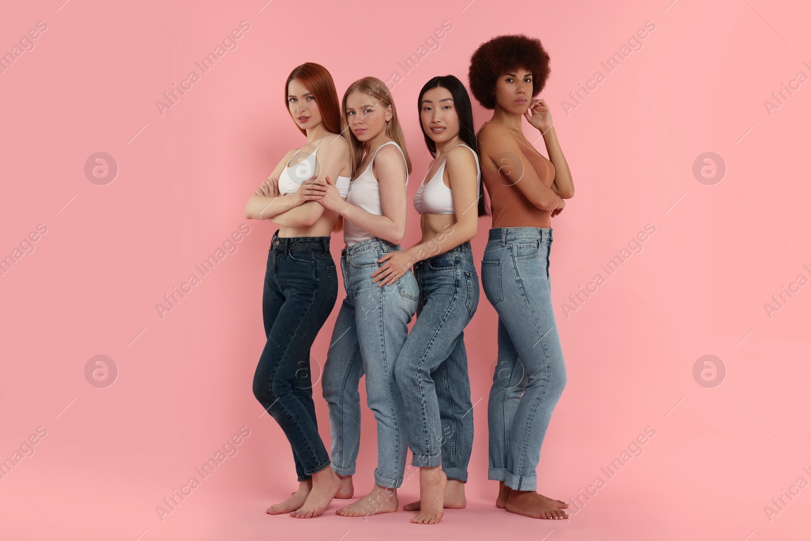 Photo of Portrait of beautiful young women on pink background