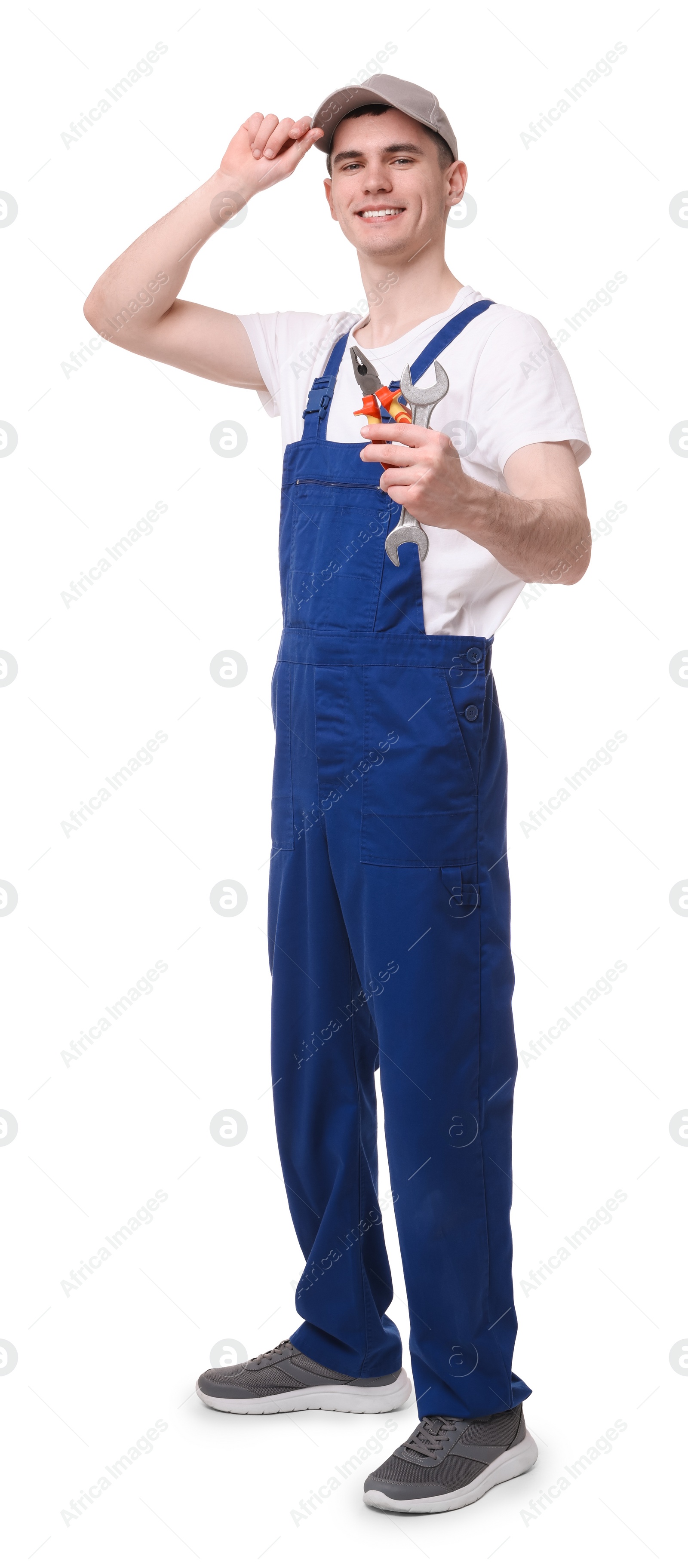 Photo of Young man holding pliers on white background