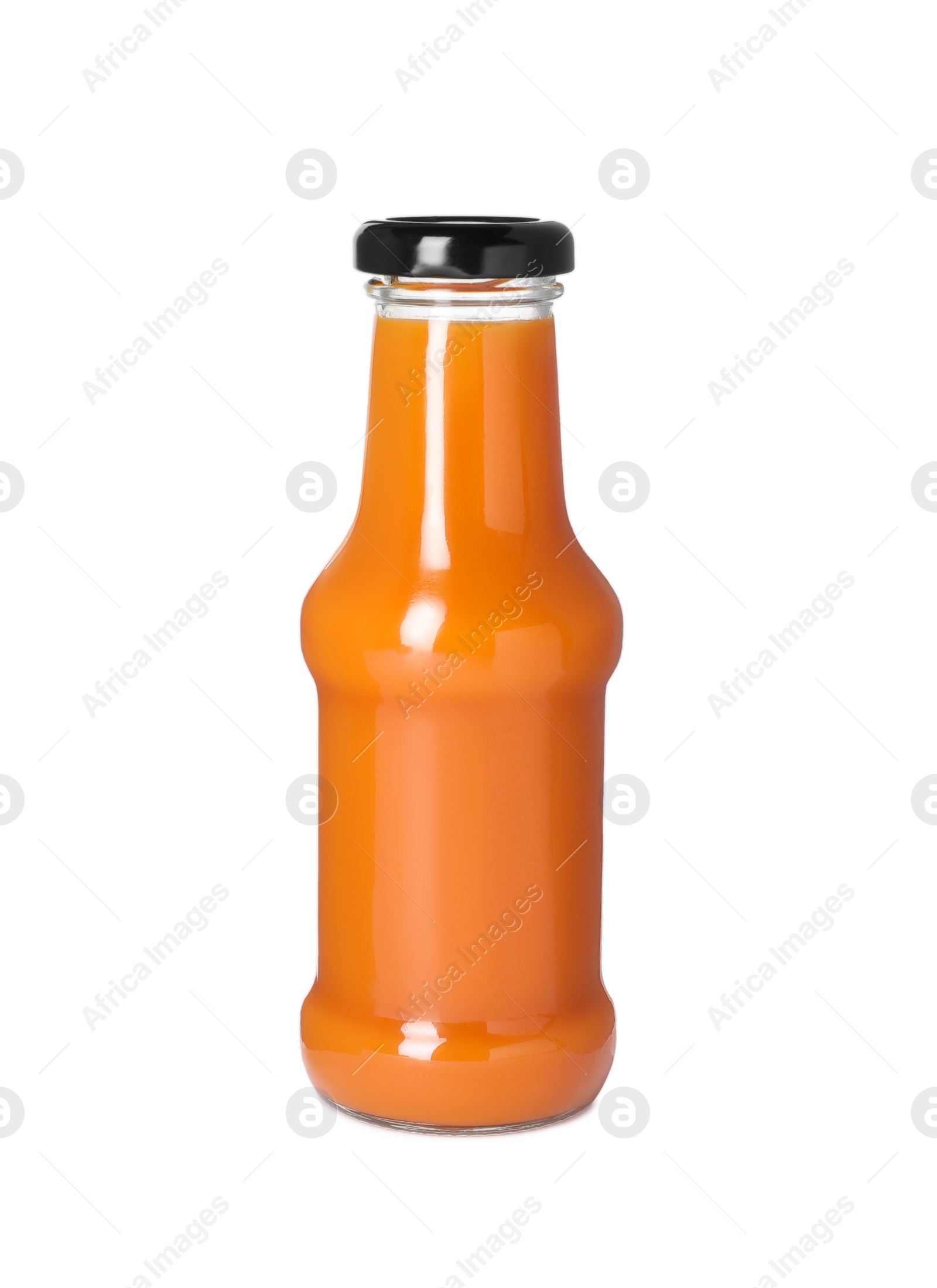 Photo of Fresh carrot juice in glass bottle isolated on white