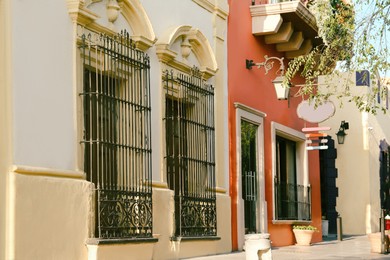 Exterior of building with window, steel grilles and door