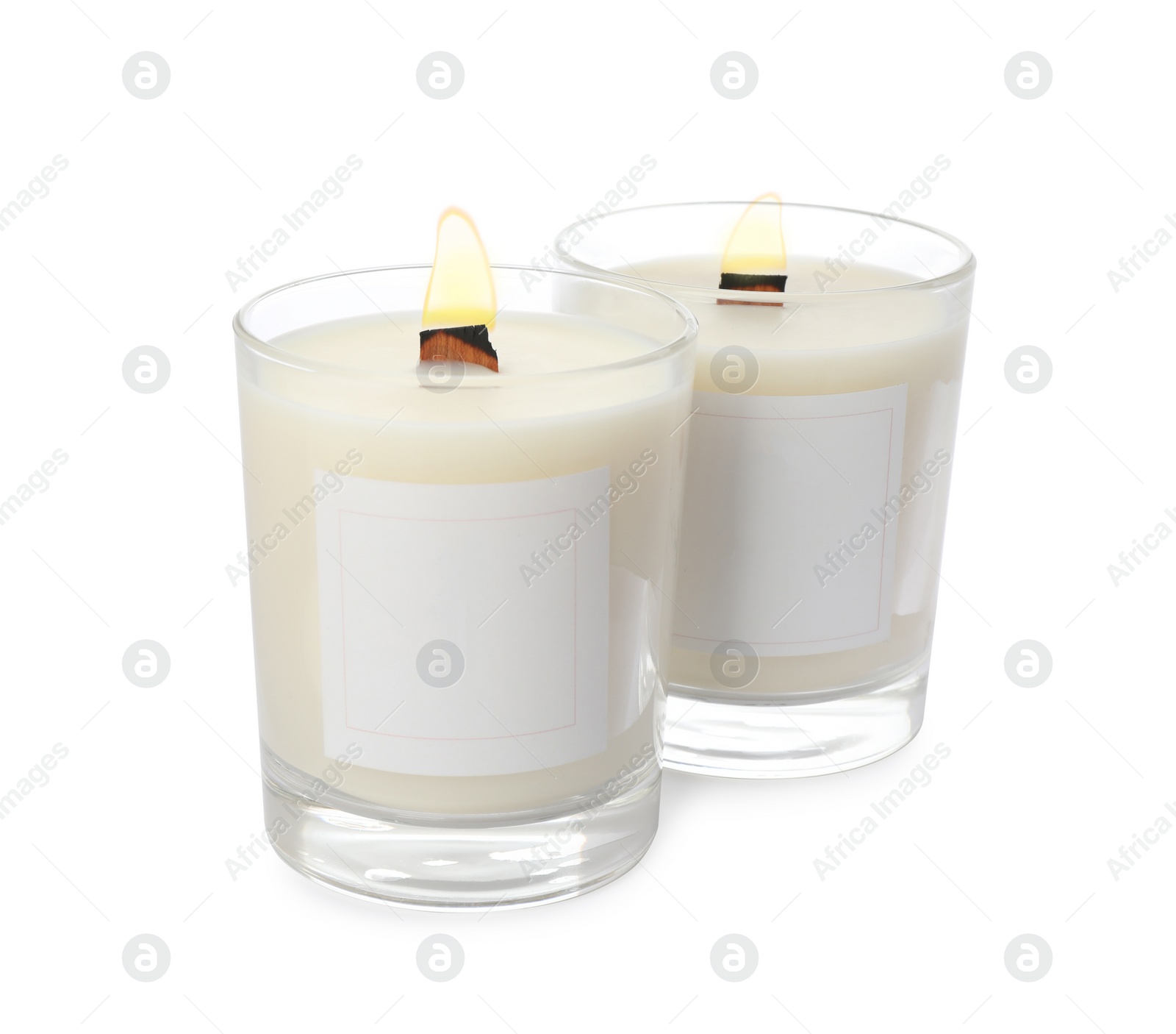 Photo of Aromatic soy candles with wooden wicks on white background