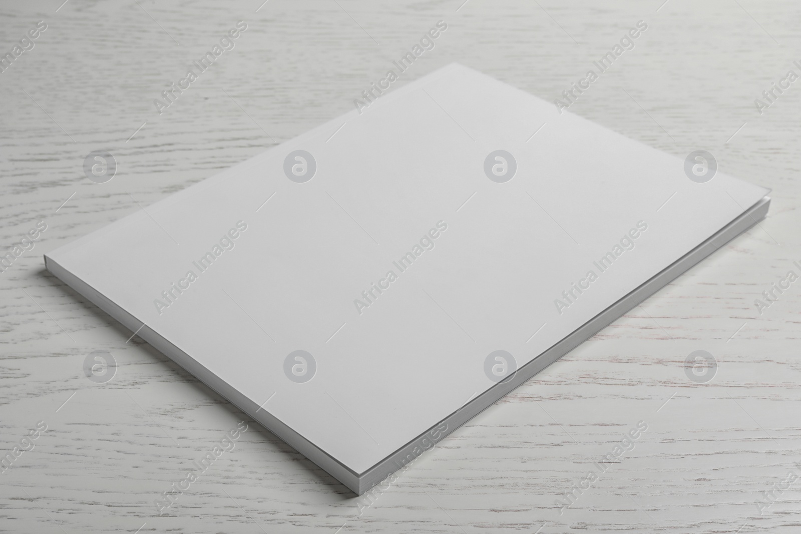 Photo of Brochure with blank cover on wooden background. Mock up for design