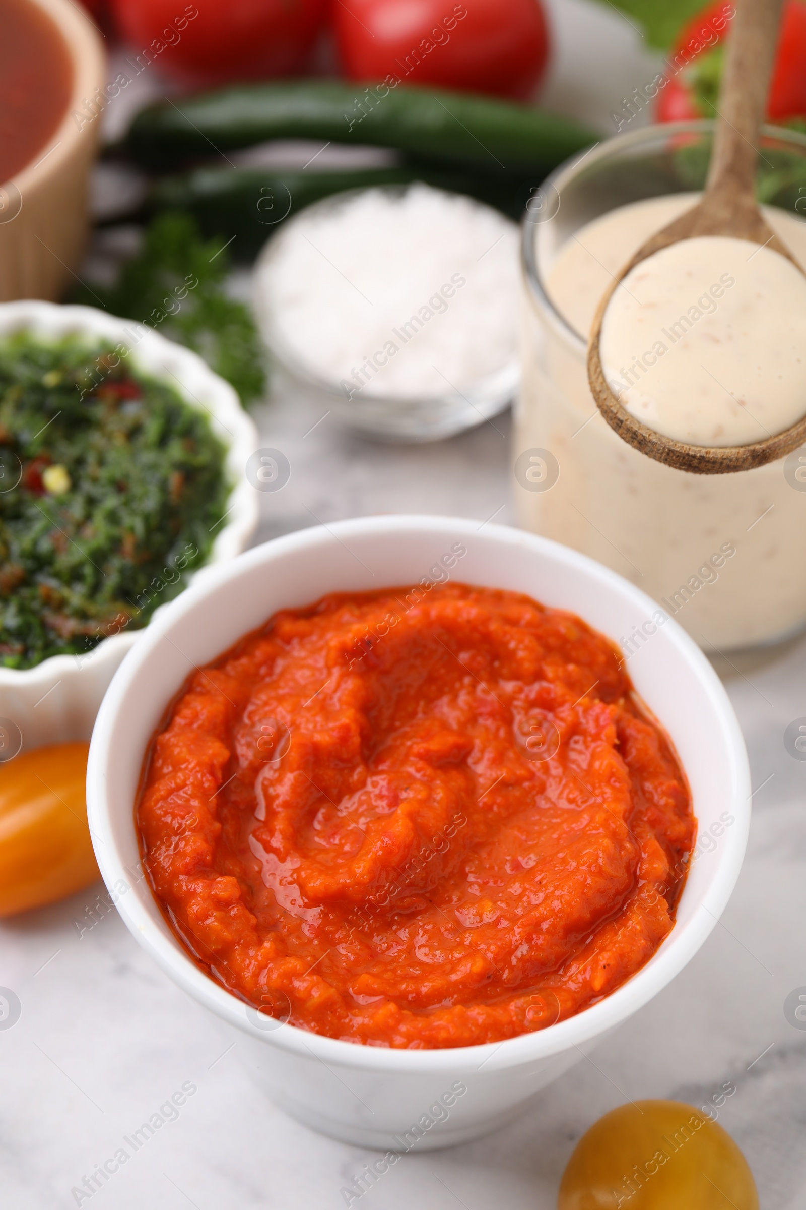 Photo of Fresh homemade marinade in bowl on table, closeup