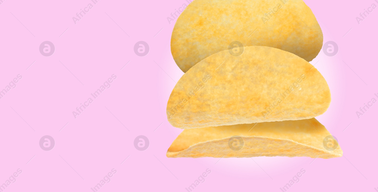 Image of Stack of tasty potato chips on light violet background, space for text