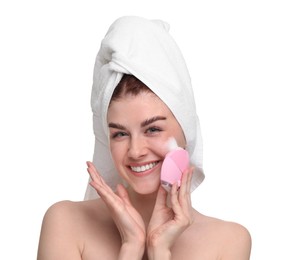 Young woman washing face with brush and cleansing foam on white background