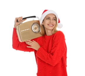 Happy woman with vintage radio on white background. Christmas music