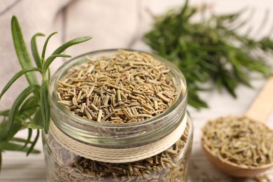 Photo of Dry and fresh rosemary against blurred background, closeup