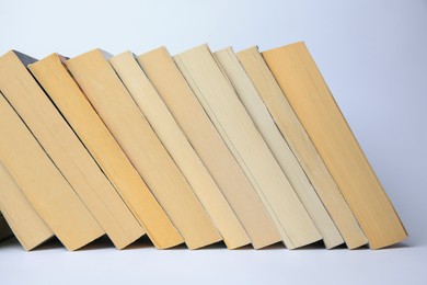 Photo of Collection of different books on light background