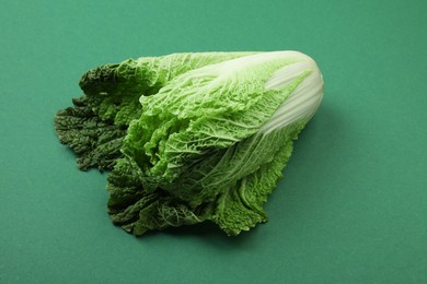Photo of Fresh ripe Chinese cabbage on green background