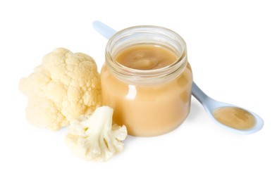 Photo of Tasty baby food in jar, spoon and fresh cauliflower isolated on white