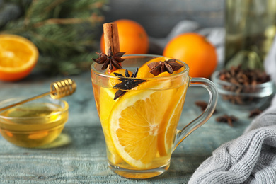 Aromatic mulled wine on light blue wooden table
