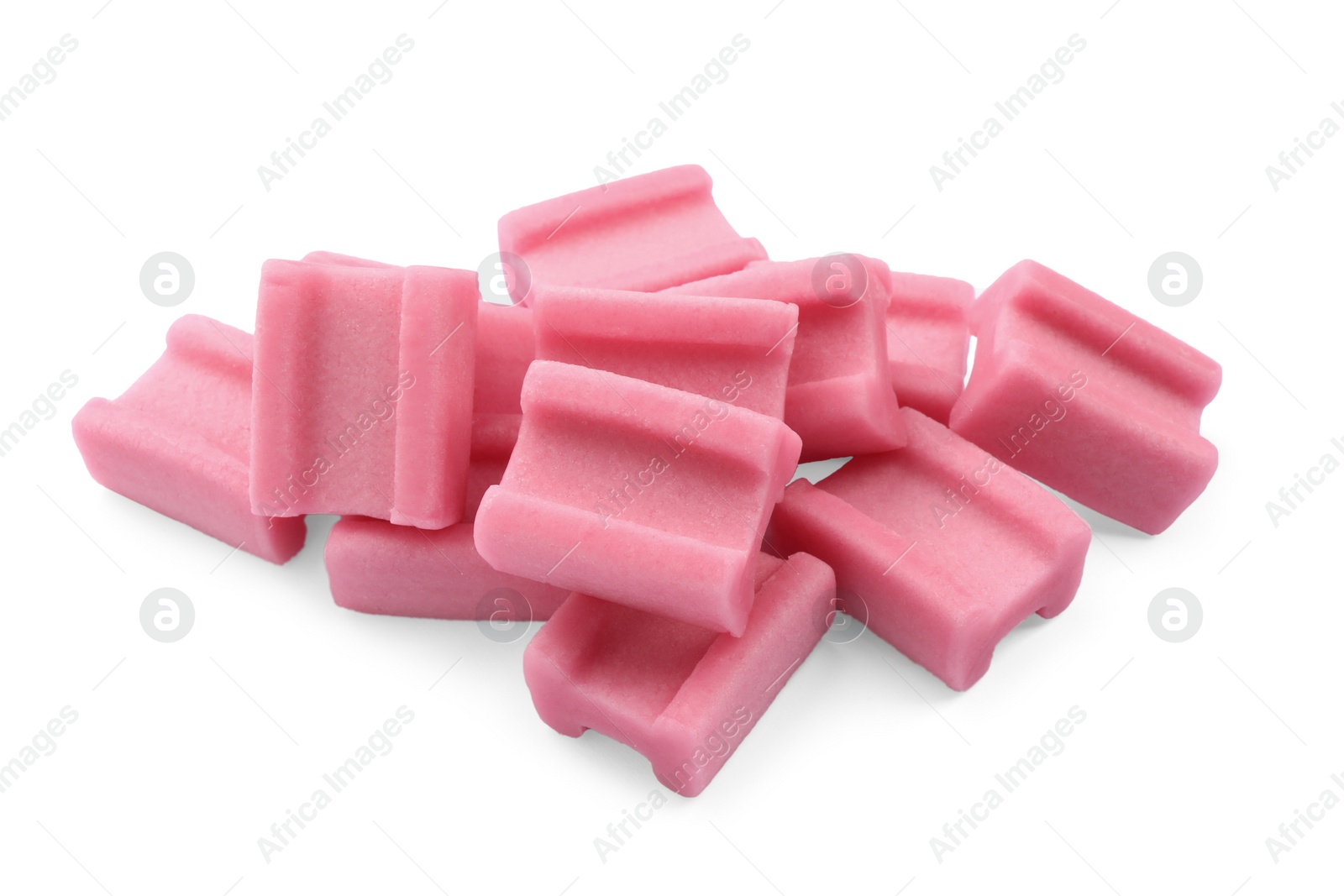 Photo of Pile of tasty pink chewing gums on white background