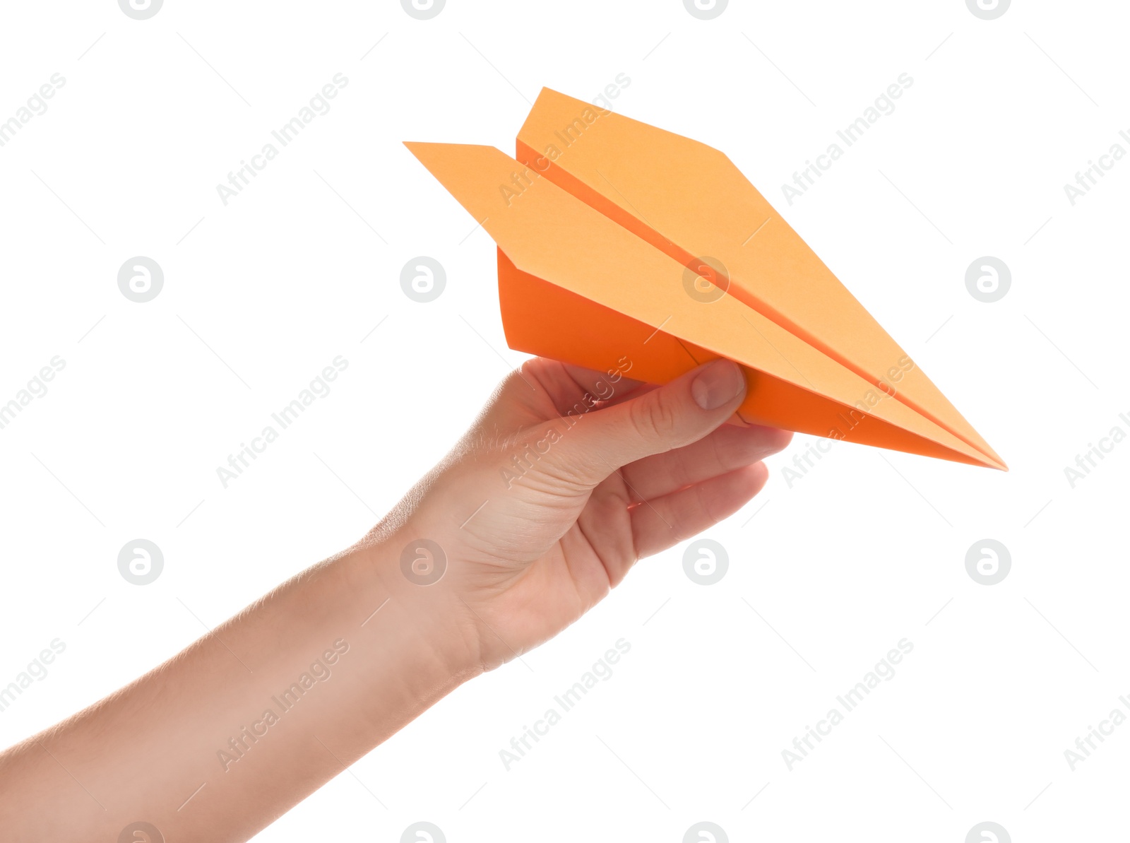 Photo of Woman holding orange paper plane on white background, closeup