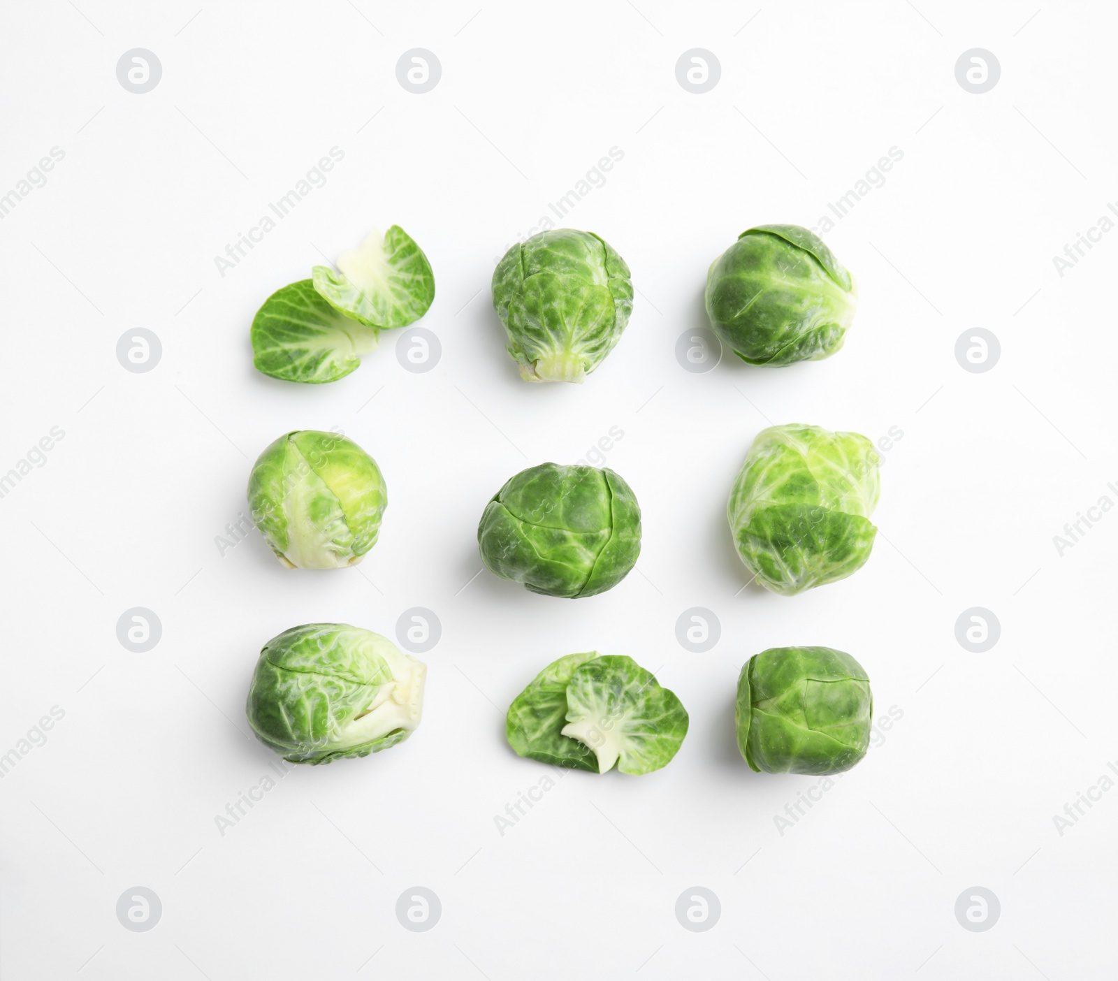 Photo of Fresh Brussels sprouts on white background, top view