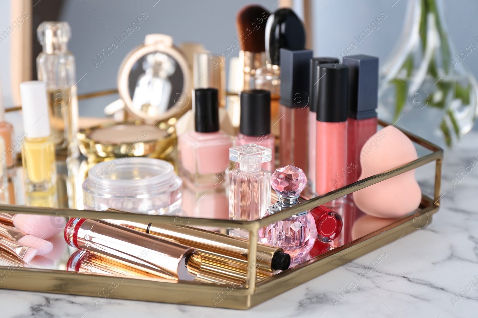 Photo of Tray with set of luxury cosmetics on dressing table