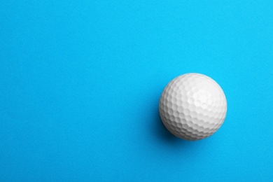 Photo of Golf ball on color background, top view. Space for text