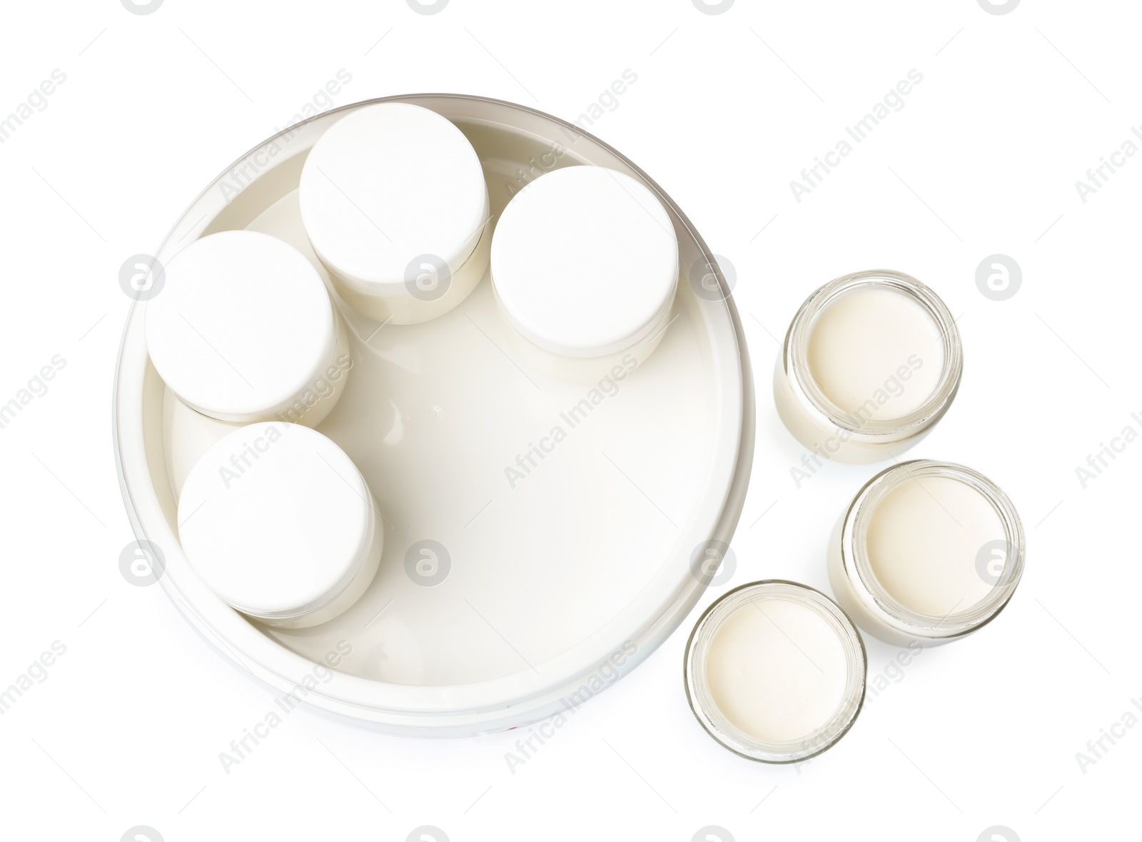 Photo of Modern yogurt maker with full jars on white background, top view