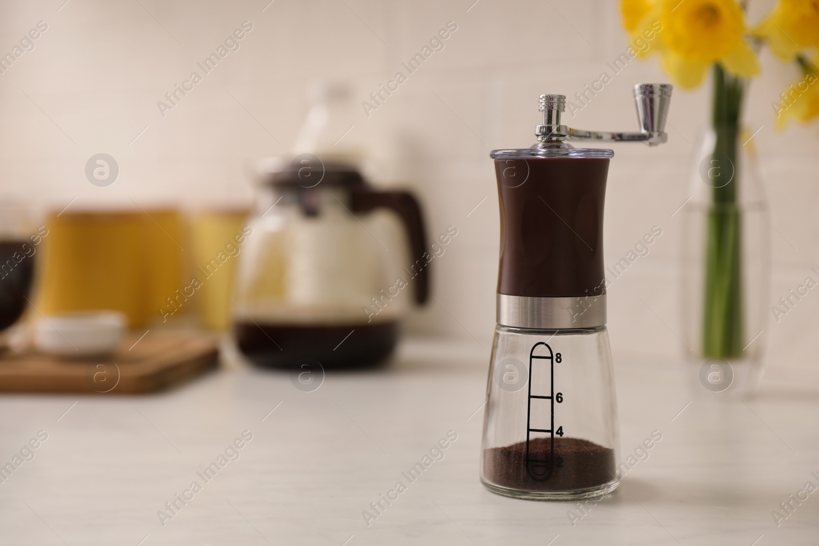 Photo of Manual coffee grinder on counter in kitchen