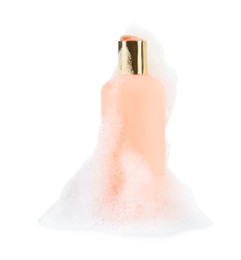 Photo of Bottle of bubble bath with foam isolated on white