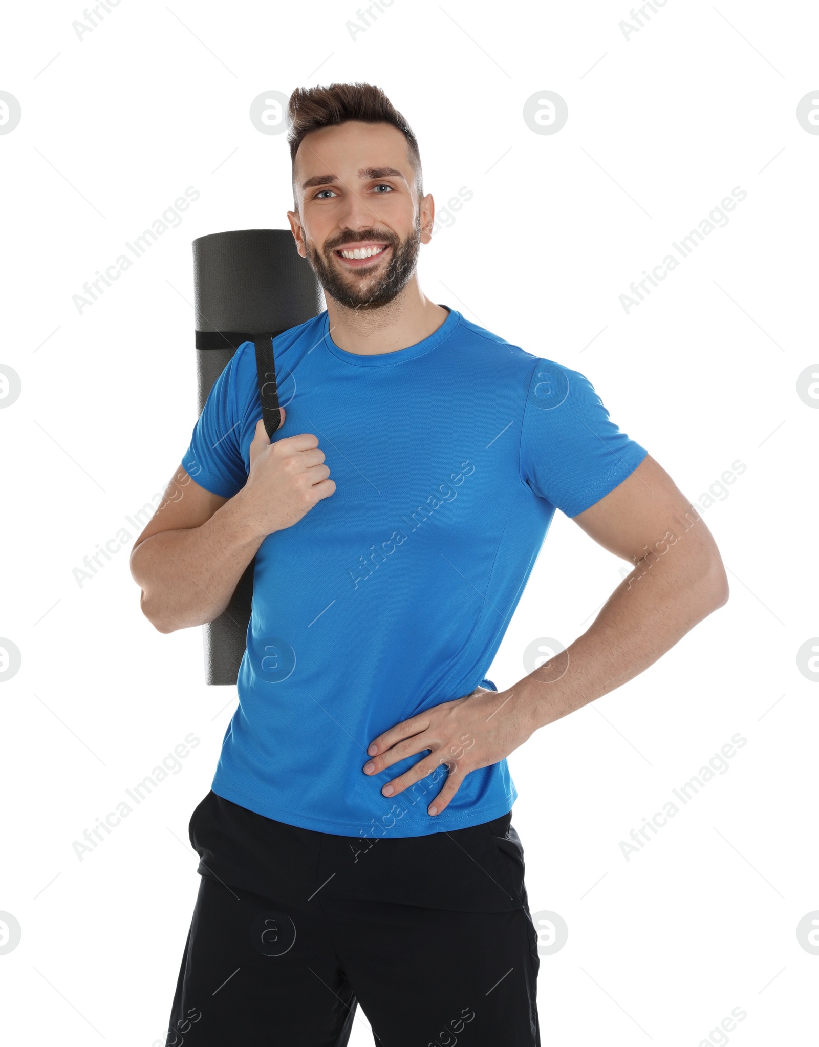 Photo of Handsome man with yoga mat on white background