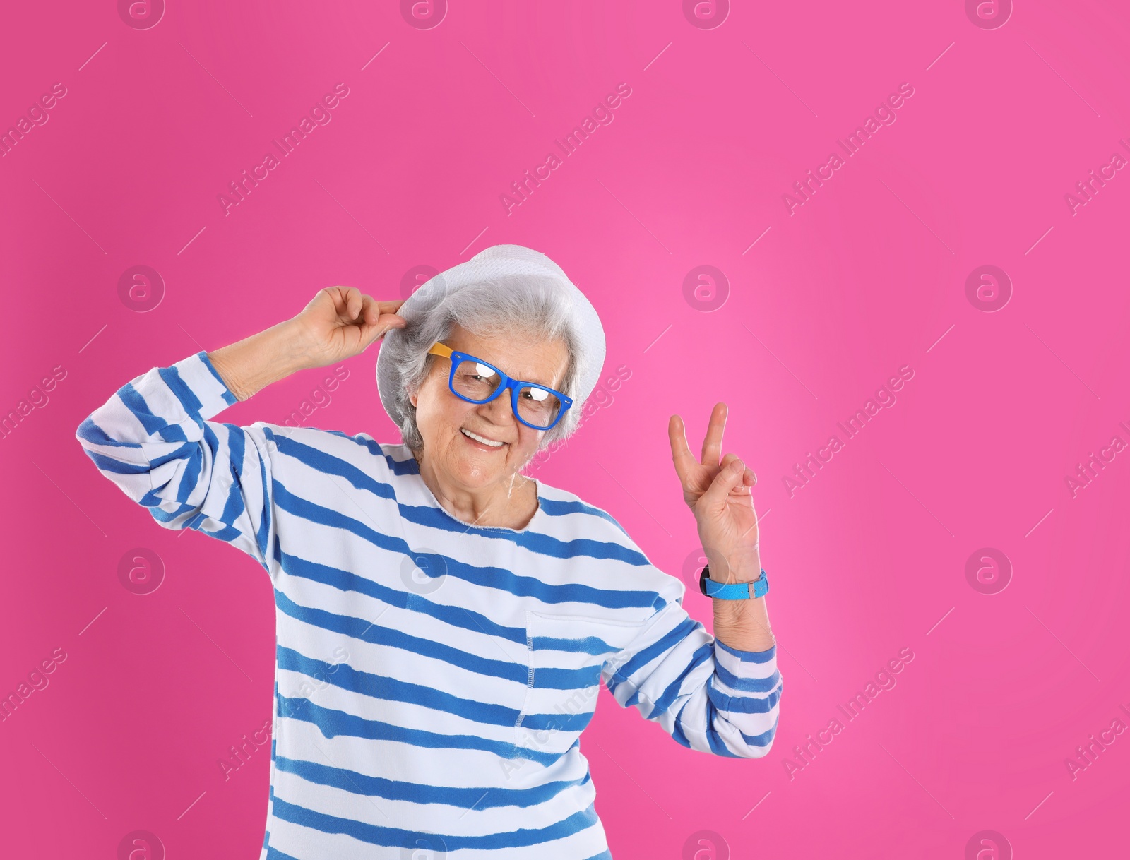 Photo of Portrait of cool grandmother on color background, space for text