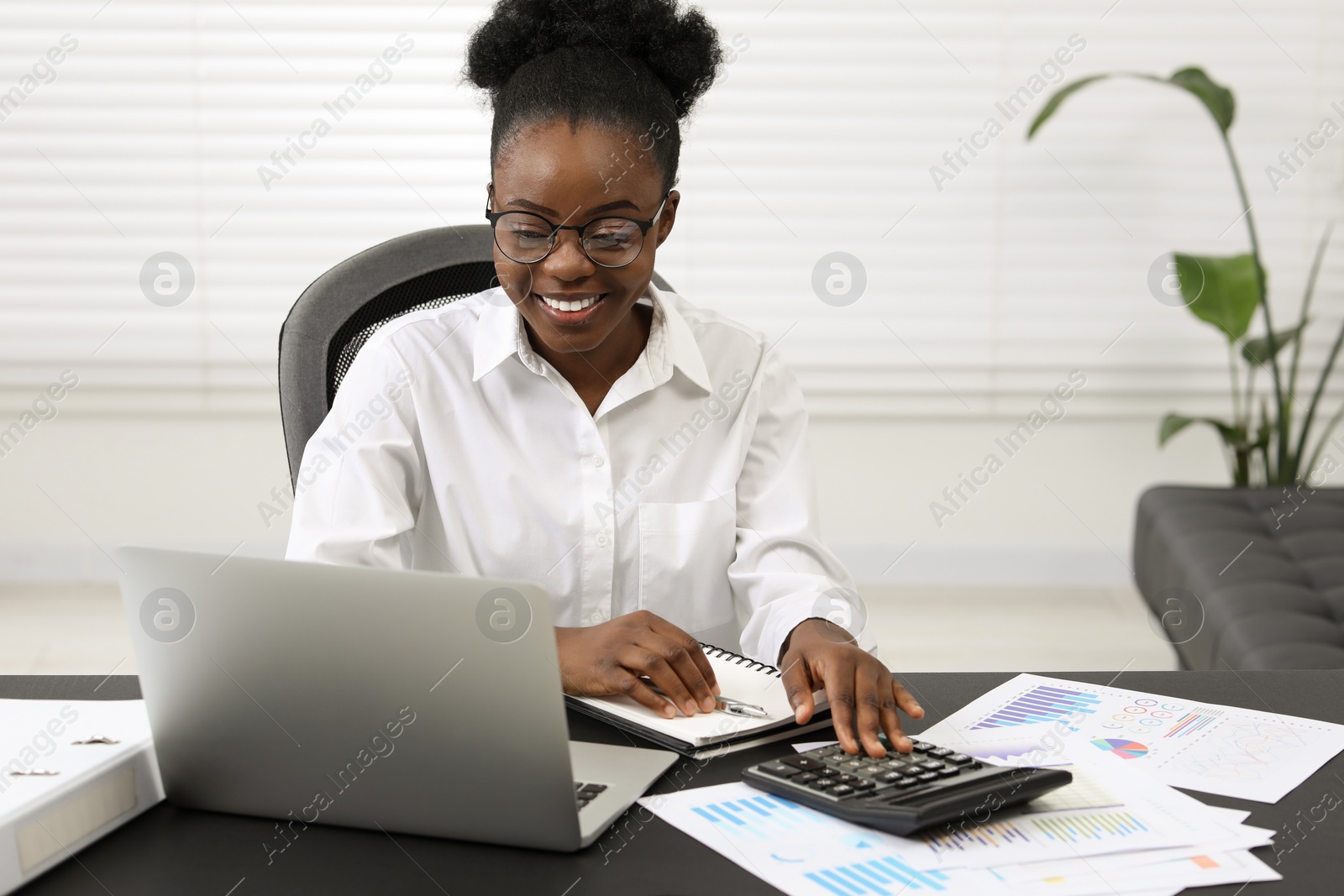 Photo of Professional accountant working at desk in office