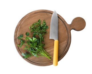 Photo of Wooden cutting board with parsley and chef's knife isolated on white, top view
