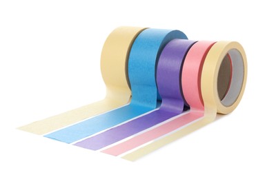 Photo of Many different rolls of adhesive tape on white background